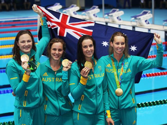 Australian swimming team in the olympics holding medals